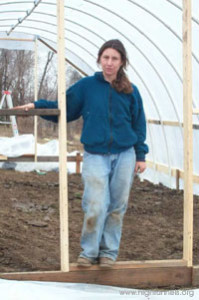 Katherine Kelly in her newly constructed hoop house.